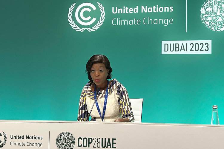 Arlette Soudan-Nonault, the Republic of Congo’s minister of tourism and the evironment, holds a press conference on lack of forests finance at COP28 in Dubai. Image by Alec Luhn.