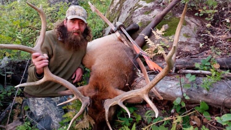 Paonia, Colorado resident Dan Vigueria and bull elk, 2022, courtesy Grizzly Bows LLC