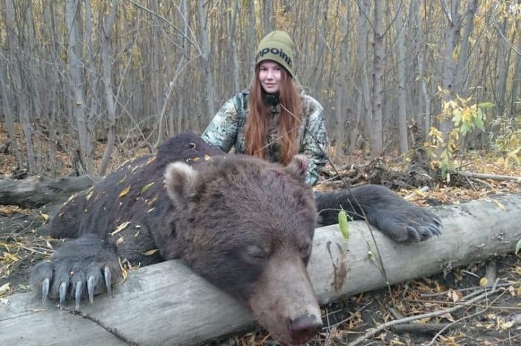 Female trophy hunter poses with slaughtered bears and boasts about skinning them